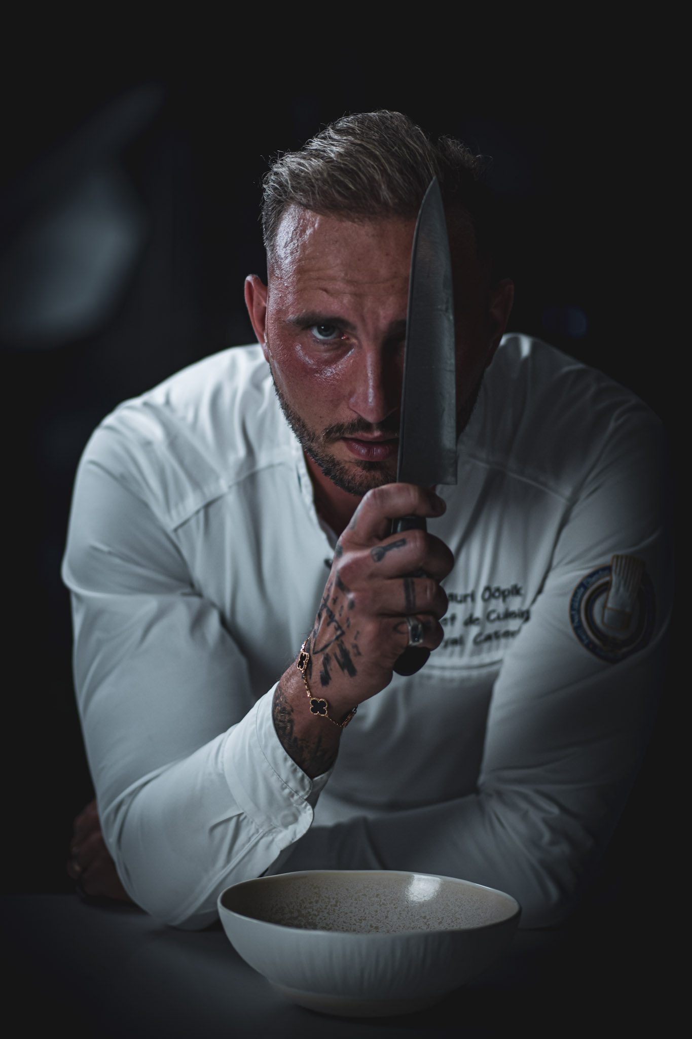 Lauri Ööpik, chef de cuisine, holding a knife